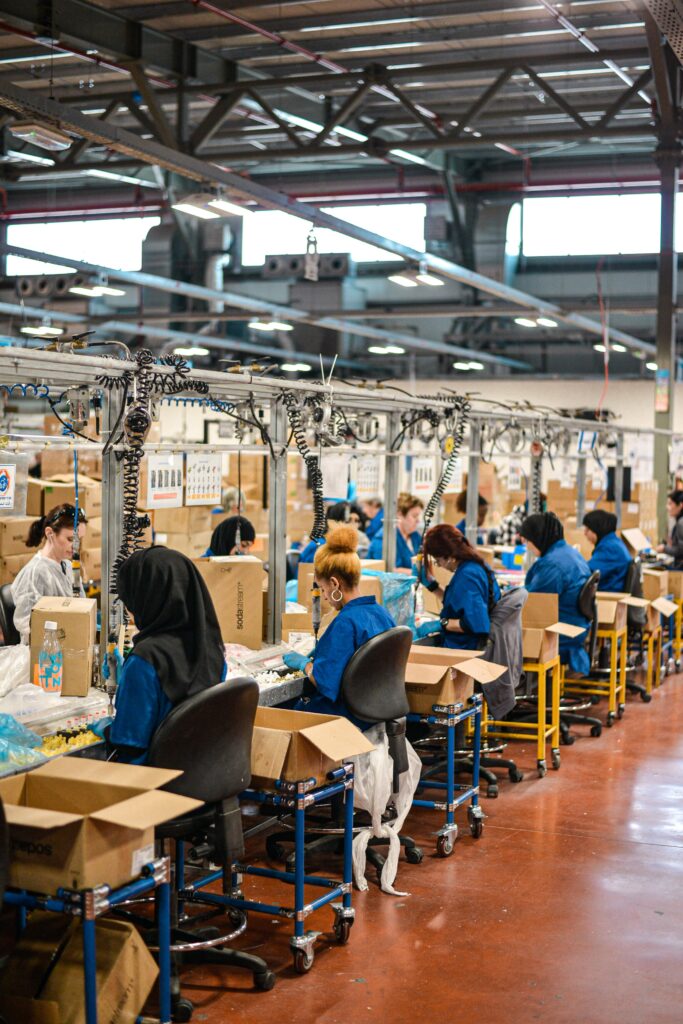 Photo of women working at a factory in a row